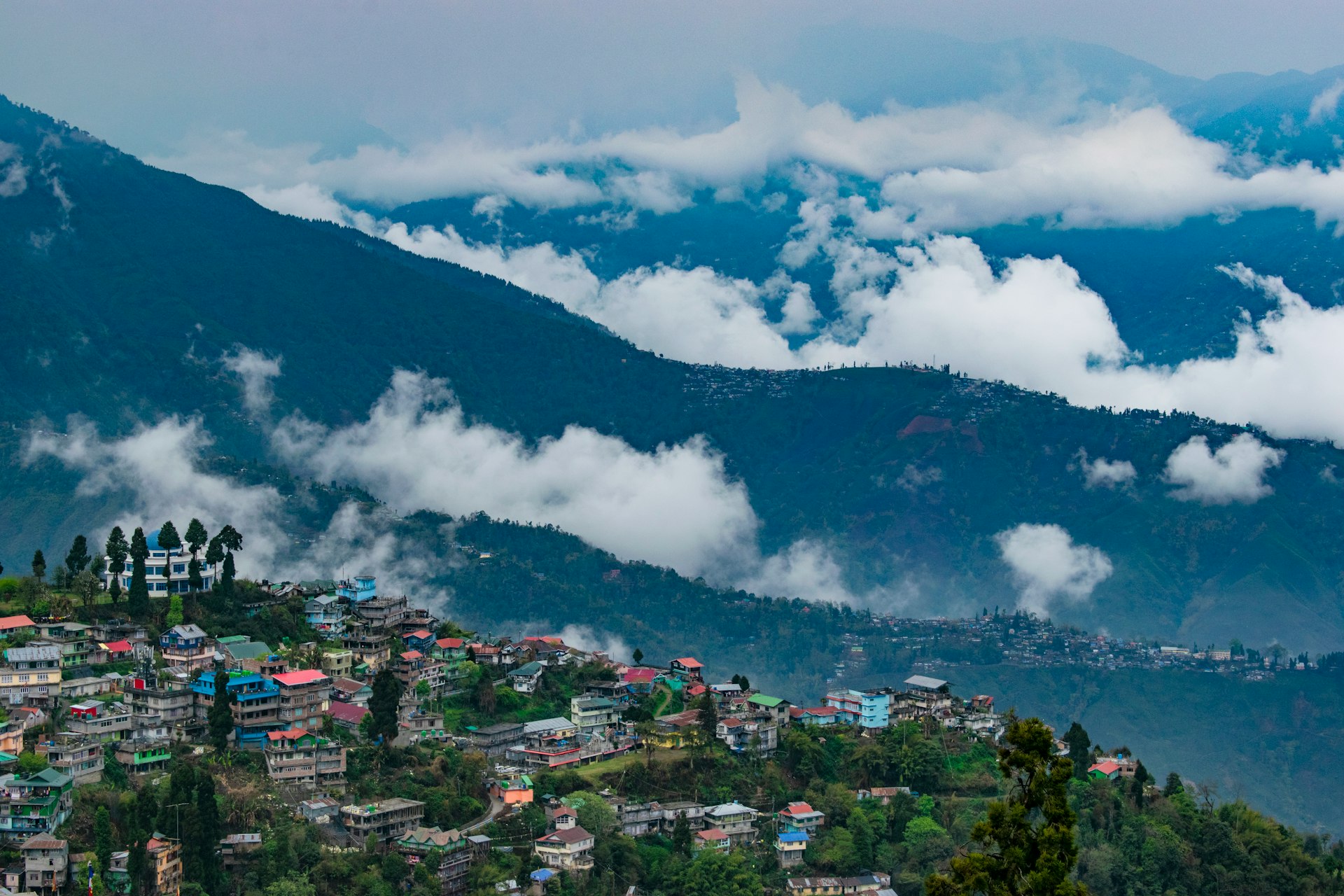 Hill station town covered with clouds India