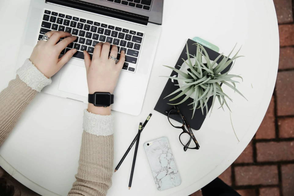 Person planning travel on laptop booking trip