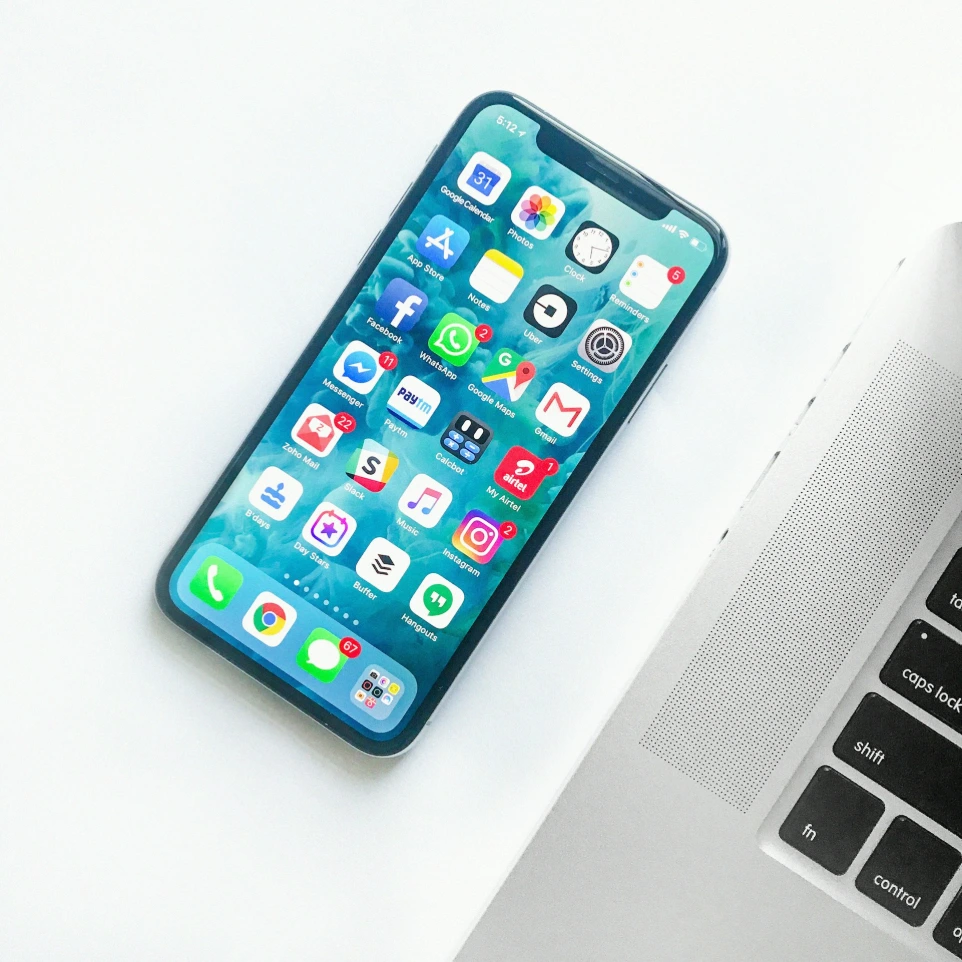 Smartphone on desk for travel booking contact