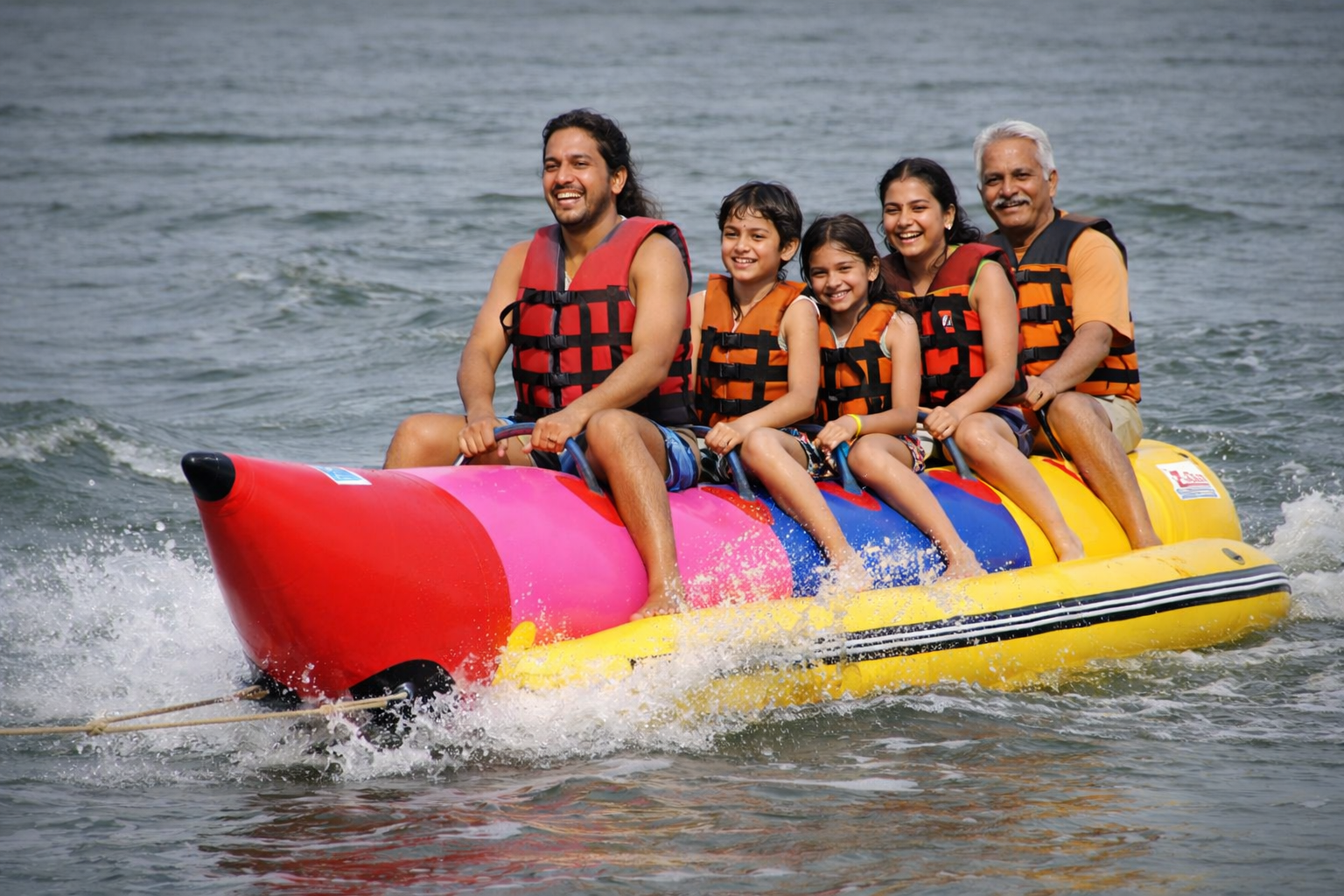 Family banana boat ride water sports India